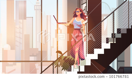 businesswoman using laptop on staircase modern loft interior open space home office for corporate or freelance work 101766781