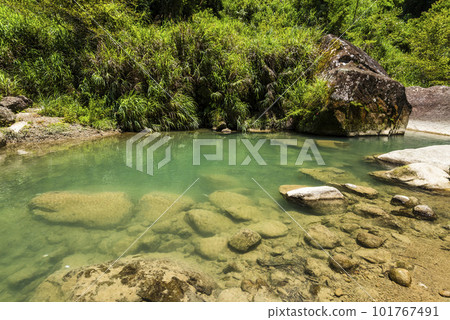 Natural view of stones in the stream at the valley of Sun-Link-Sea Forest Recreation Area in Nantou, Taiwan. 101767491