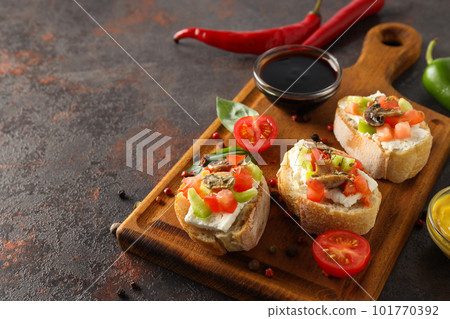 Toasts with grilled vegetables, space for text Toasts with grilled vegetables, space for text 101770392