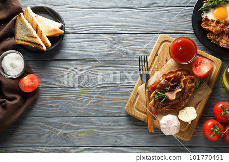 Fried bacon and egg - tasty breakfast, top view Fried bacon and egg - tasty breakfast, top view 101770491