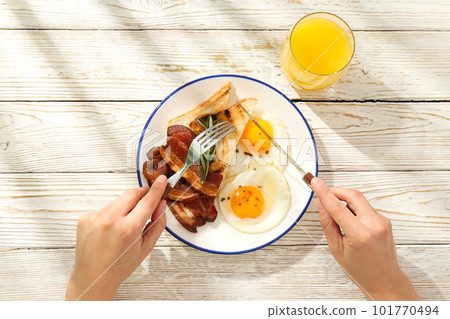 Fried bacon and egg - tasty breakfast, top view 101770494