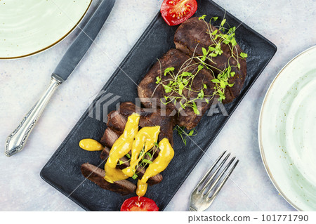 Fried ostrich steaks. Fried ostrich steaks. 101771790