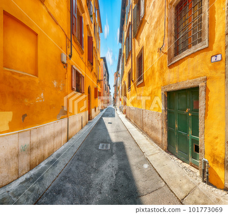 Fantastic narrow street of shops and cafes in the historic medieval old town center of Verona. Fantastic narrow street of shops and cafes in the historic medieval old town center of Verona. 101773069