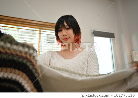 Asian female fashion designers working on new collection at home office. Online seller, business and technology 101773136