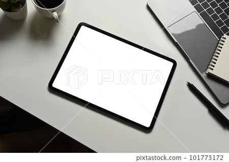 Modern workplace with digital tablet, coffee cup and laptop computer. Blank screen for your advertising text message 101773172