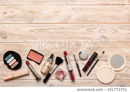 Professional makeup tools. Top view. Flat lay. Beauty, decorative cosmetics. Makeup brushes set and color eyeshadow palette on table background. Minimalistic style Professional makeup tools. Top view. Flat lay. Beauty, decorative cosmetics. Makeup brushes set and color eyeshadow palette on table background. Minimalistic style 101773731
