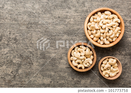 cashew nuts in wooden bowl on table background. top view. Space for text Healthy food 101773758
