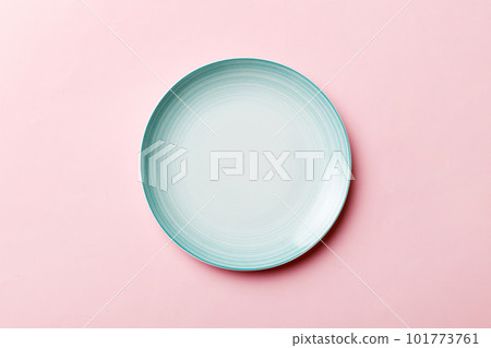 Top view of isolated of colored background empty round blue plate for food. Empty dish with space for your design Top view of isolated of colored background empty round blue plate for food. Empty dish with space for your design 101773761