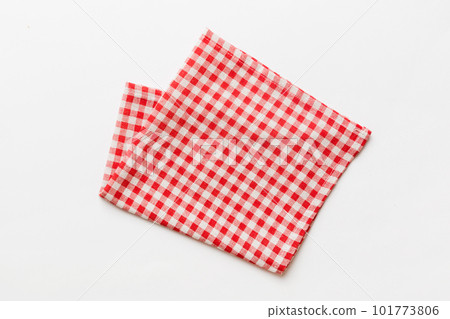 top view with red empty kitchen napkin isolated on table background. Folded cloth for mockup with copy space, Flat lay. Minimal style top view with red empty kitchen napkin isolated on table background. Folded cloth for mockup with copy space, Flat lay. Minimal style 101773806