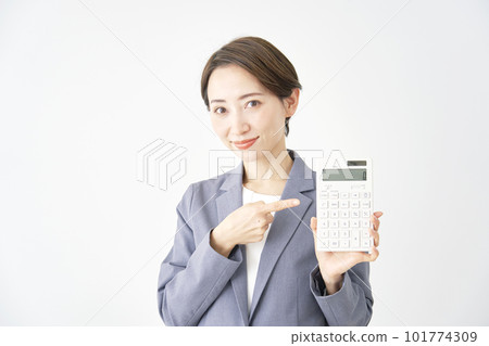 Business woman holding a calculator White background 101774309
