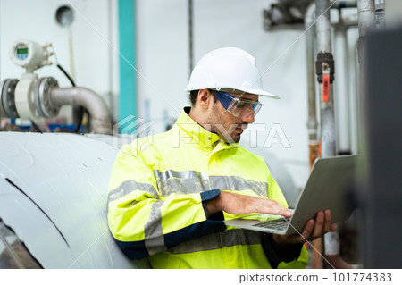 Professional Asian mechanical engineer inspecting the machines in the automated manufacturing factory. Expertise occupation concept. 101774383