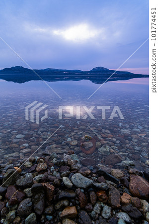 A morning on the lake where you can see the bottom of the lake transparently. Lake Kussharo in Hokkaido. A morning on the lake where you can see the bottom of the lake transparently. Lake Kussharo in Hokkaido. 101774451