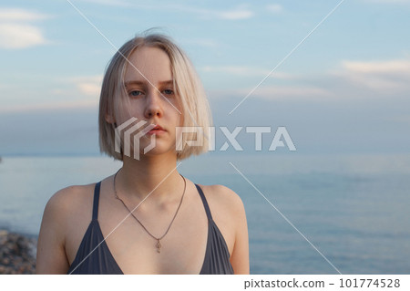 Portrait of beautiful short-haired blonde girl 17 years old standing Portrait of beautiful short-haired blonde girl 17 years old standing 101774528