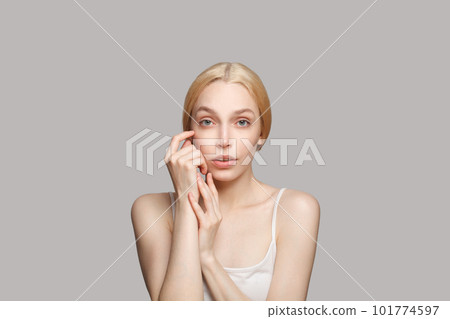 Pretty female face. Young blonde woman with clean healthy skin. Facial treatment, skincare  101774597