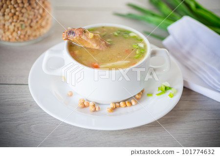 dried pea soup in a plate with herbs 101774632