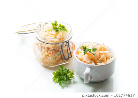 Sauerkraut with carrots and spices in a glass jar 101774637
