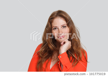 Attractive joyful redhead model woman with long wavy ginger hair portrait 101775019