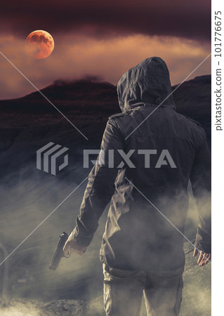 man from behind with gun in hand, background mountains man from behind with gun in hand, background mountains 101776675