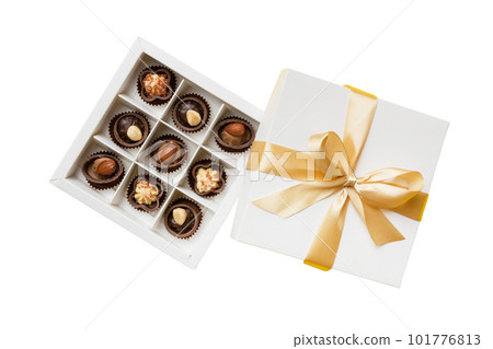 Chocolate candy in a box with a colored bow. Gift box with Chocolates isolated on white top view Chocolate candy in a box with a colored bow. Gift box with Chocolates isolated on white top view 101776813