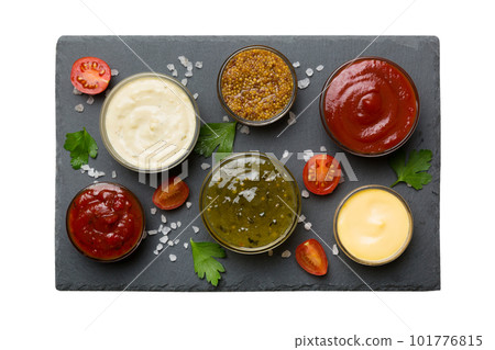 Many different sauces and herbs isolated on white background, flat lay top view. sauces on plate, healthy concept Many different sauces and herbs isolated on white background, flat lay top view. sauces on plate, healthy concept 101776815