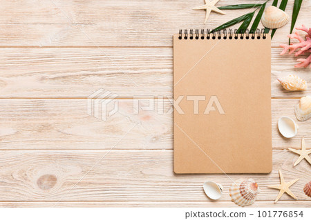 Blank writing book with summer beach accessories on background, copy space. Flat lay with copy space Blank writing book with summer beach accessories on background, copy space. Flat lay with copy space 101776854