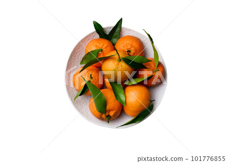 Fresh cutted clementines and whole mandarin over round plate isolated on white background. Food and drink ingredients preparing. healthy eating theme top view with copy space Fresh cutted clementines and whole mandarin over round plate isolated on white background. Food and drink ingredients preparing. healthy eating theme top view with copy space 101776855