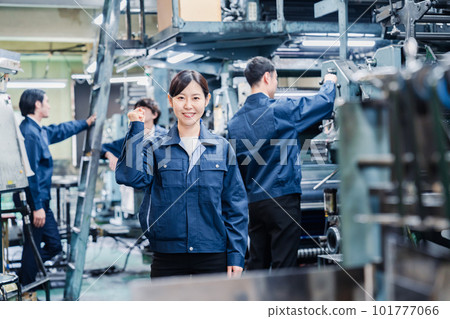 Factory worker doing a guts pose 101777066