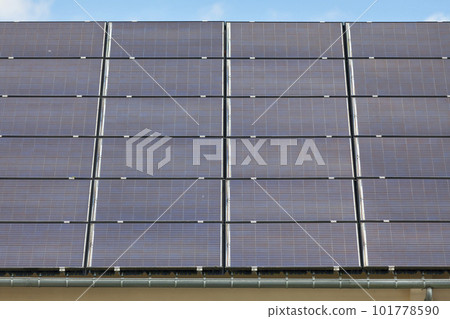 Solar panels covering the roof of a building 101778590