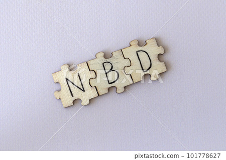 The acronym NBD, which stands for No Big Deal. The letters written on the puzzles. 101778627