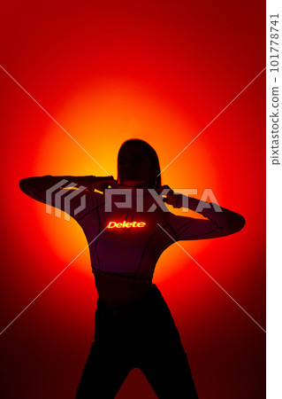 Portrait with sensual female silhouette and digital neon filter lights with inscryption on body on gradient red mode background. A break up, delete 101778741