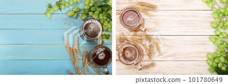 glass of foamy beer with hop cones and wheat on blue wooden background. Top view with copy space for your text 101780649