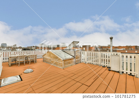 a roof that looks like it's made out of wood, with the sky and clouds in the background a roof that looks like it's made out of wood, with the sky and clouds in the background 101781275