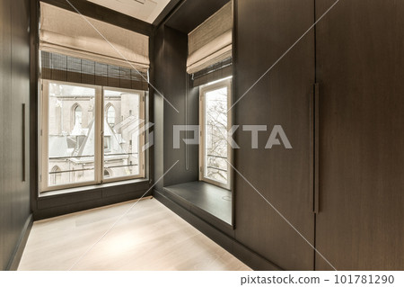 an empty room with wooden floors and large windows that look out onto the cityscapea photo taken from inside an empty room with wooden floors and large windows that look out onto the cityscapea photo taken from inside 101781290