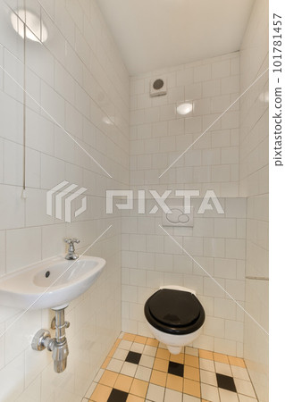 a bathroom with black and white tiles on the floor, sink and faucet in the shower stall area a bathroom with black and white tiles on the floor, sink and faucet in the shower stall area 101781457