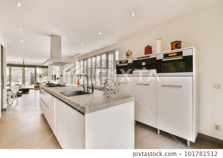 a kitchen with white cabinets and counter space for the sink, oven, microwave and dishwasher in it a kitchen with white cabinets and counter space for the sink, oven, microwave and dishwasher in it 101781512