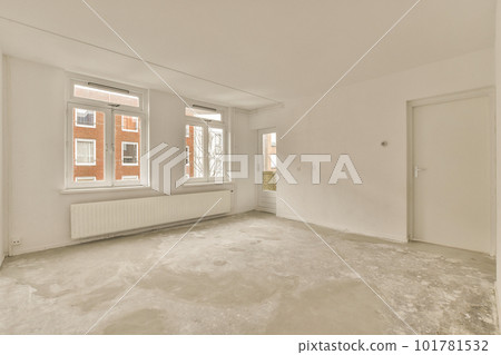 an empty room with white walls and no one person standing in the room, looking out to the street outside an empty room with white walls and no one person standing in the room, looking out to the street outside 101781532