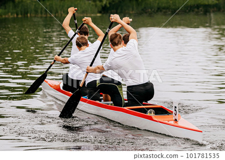 male junior canoeist on canoe four in canoeing competition race, sports summer games 101781535