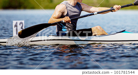 close-up kayaker athlete on kayak single in kayaking championship race, boat number 13 close-up kayaker athlete on kayak single in kayaking championship race, boat number 13 101781544