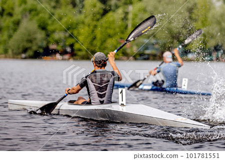 two male athlete kayaker on kayak single rowing kayaking championship race, sports summer games 101781551