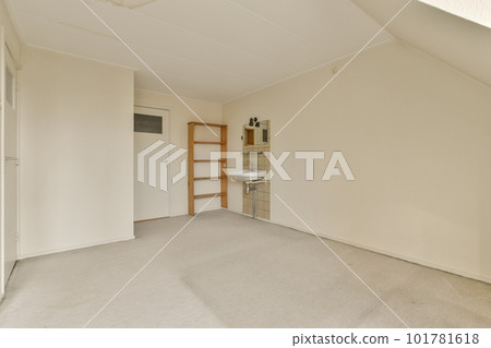 an empty room with white walls and no one person standing in the corner, or looking out to the right 101781618