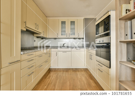 a kitchen with all white cupboards and appliances on the counter tops in this photo is taken from the inside 101781655