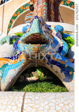 Multicolored mosaic dragon salamander of Gaudi in Park Guell, Barcelona, Spain 101782037