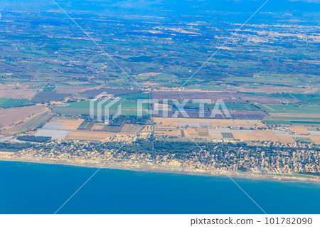 View from a flying plane on Fiumicino bay and the Tyrrhenian sea, Italy View from a flying plane on Fiumicino bay and the Tyrrhenian sea, Italy 101782090