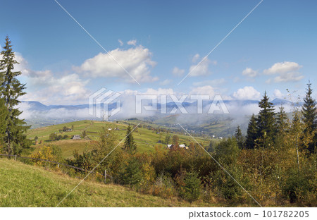 Beautiful autumn morning near Carpathian village outskirts (Carpathian mountain, Ukraine). Beautiful autumn morning near Carpathian village outskirts (Carpathian mountain, Ukraine). 101782205