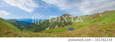 Alpine lake Brebeneckul on summer mountain ravine (Ukraine, Chornogora Ridge, Carpathian Mountains). Alpine lake Brebeneckul on summer mountain ravine (Ukraine, Chornogora Ridge, Carpathian Mountains). 101782238