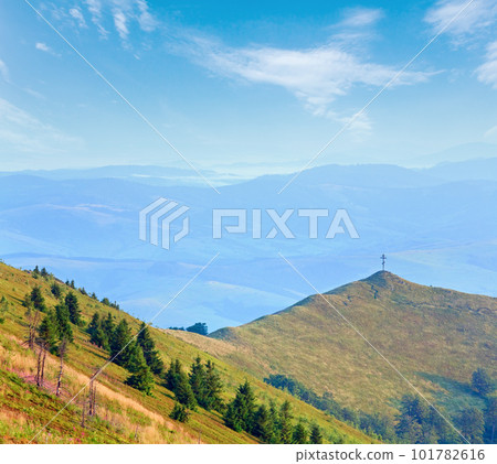 Summer misty mountain landscape with christian cross on top (Ukraine, Carpathian Mountains) 101782616