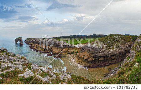 Cliffs and canyon in town of Llanes Villahormes, the islet known as Castro de las Gaviotas (Asturias, Spain). Cliffs and canyon in town of Llanes Villahormes, the islet known as Castro de las Gaviotas (Asturias, Spain). 101782738