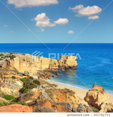 Summer evening Atlantic rocky coast view and sandy beach Praia de Sao Rafael with limestone cliffs, Albufeira, Algarve, Portugal). Summer evening Atlantic rocky coast view and sandy beach Praia de Sao Rafael with limestone cliffs, Albufeira, Algarve, Portugal). 101782751
