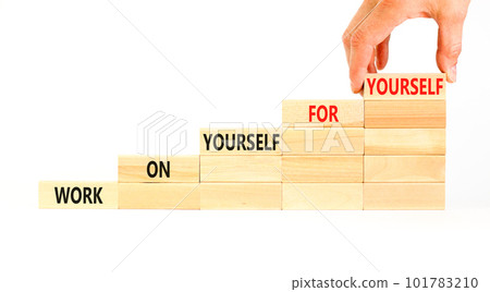 Work for yourself symbol. Concept words Work on yourself for yourself on wooden block. Beautiful white table white background. Businessman hand. Business and work for yourself concept. Copy space. 101783210