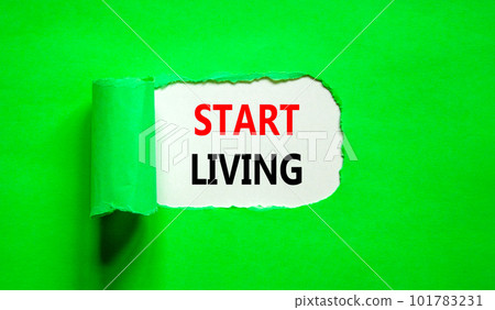 Start living symbol. Concept words Start living on beautiful white paper. Beautiful green table green background. Business and Start living concept. Copy space. Start living symbol. Concept words Start living on beautiful white paper. Beautiful green table green background. Business and Start living concept. Copy space. 101783231